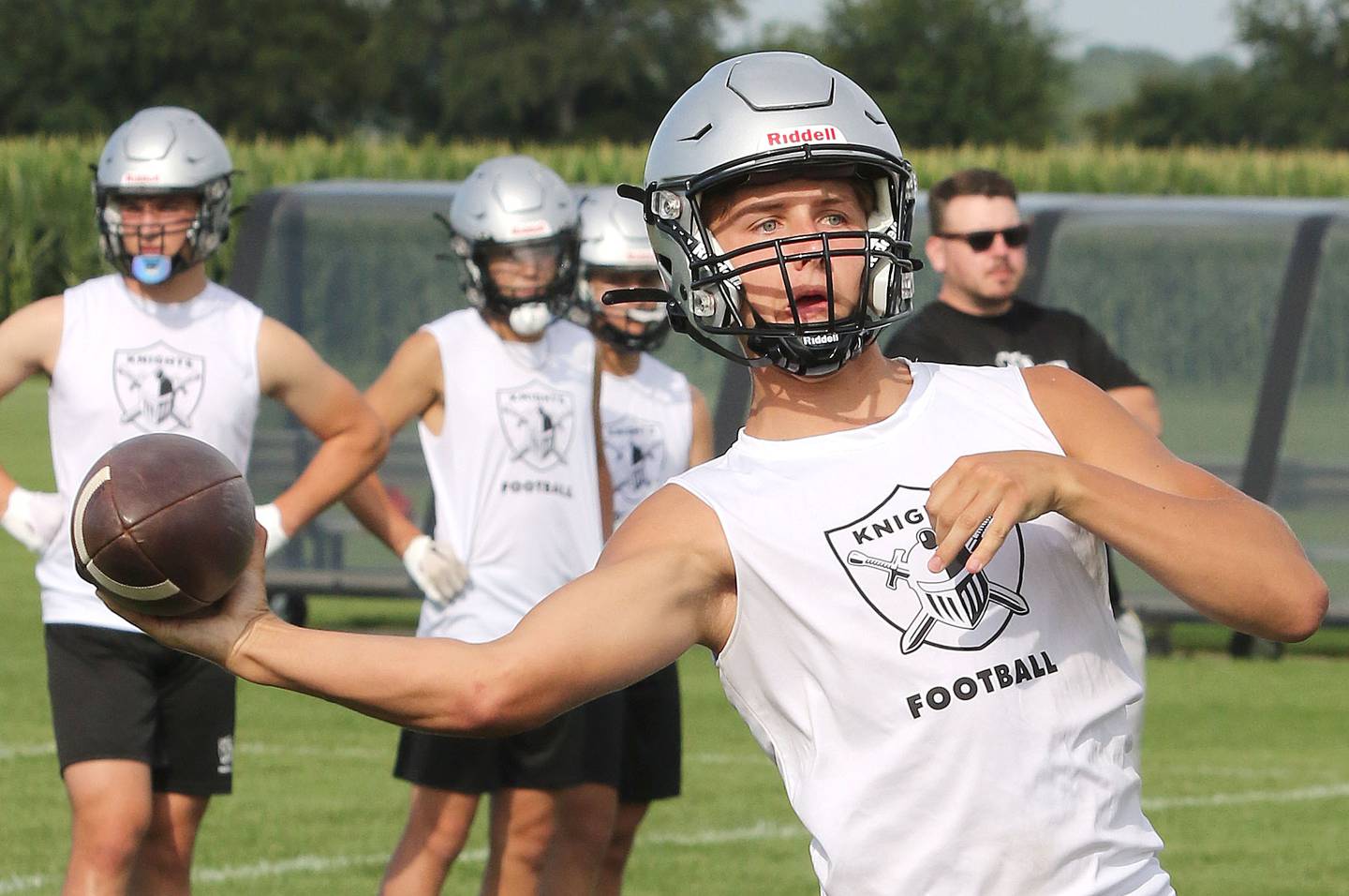 Kaneland quarterback Troyer Carlson fires a pass during 7-on-7 drills against DeKalb Tuesday, July 26, 2022, at Kaneland High School in Maple Park.