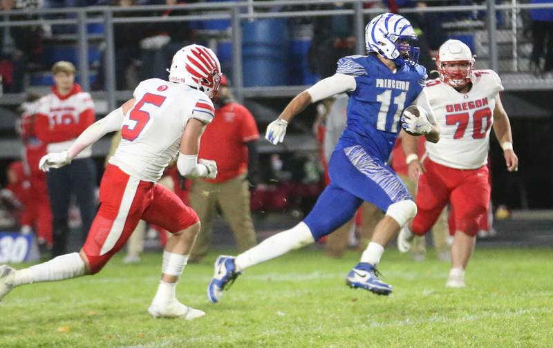 Princeton's Noah LaPorte sprints down the field to score a touchdown on this run over Oregon's Hunter Bartel during the Class 3A playoff game on Friday, Nov. 1, 2024 at Princeton High School.