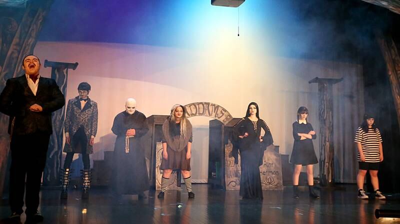 (From left) Gomez played by Adrian Silva, Lurch played by Andrew Beer, Fester, played by Max Wertz, Grandmama, played by Zoe Kidd, Morticia, played by Nora Maier, Wednesday, played by Emily Kmetz, and Pugsley played by Anneliese Bangert act out in a scene during a rehearsal of The Addams Family on Tuesday, March 14, 2023 in Matthiessen Auditorium at L-P High School. The production runs March 17-19. Showtimes will be at 7 p.m. on March 17-18, and 2 p.m. on March 19. Tickets can be purchased for $12 (adults) and $10 (children/seniors) in Matthiessen Memorial Auditorium.