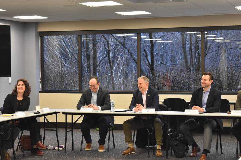 U.S. Rep. Sean Casten, center, meets Friday with clean energy industry stakeholders, leaders and advocates at a roundtable in Lisle. Casten discussed the impact a federal funding freeze would have on the industry.