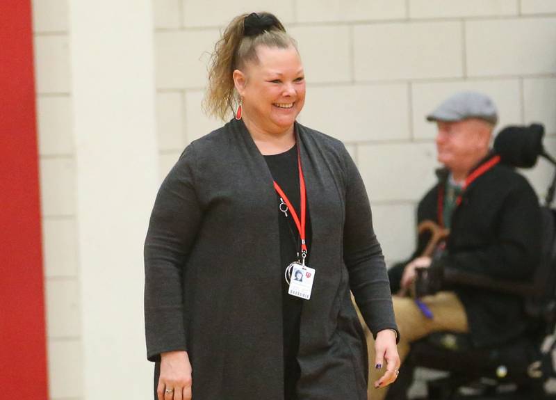 Sue (Sciarini) Gillio L-P class of  1984, is introduced at halftime during the La Salle-Peru Township High School Hall of Honor ceremony on Friday, Feb. 7, 2025 in Sellett Gymnasium at L-P High School. Gillio founded North Central Illinois ARTworks inside the Westclox building in Peru.
