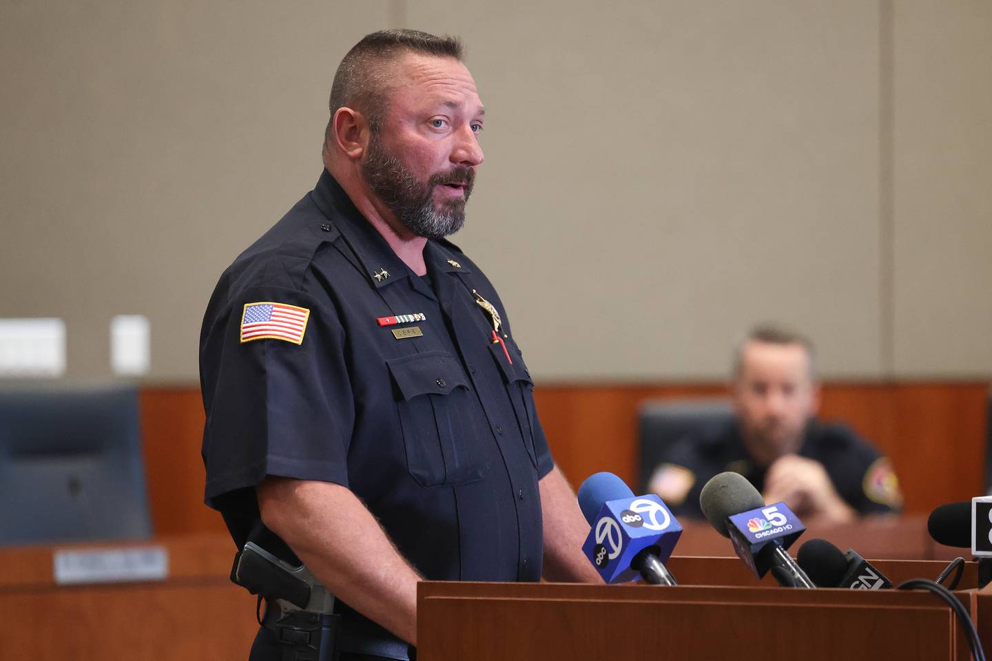 Romeoville Deputy Police Chief Chris Burne holds a press conference on police finding four bodies on Sunday, two adults and two children, with gunshot wounds during a well-being check on Monday, Sept. 18, in Romeoville.