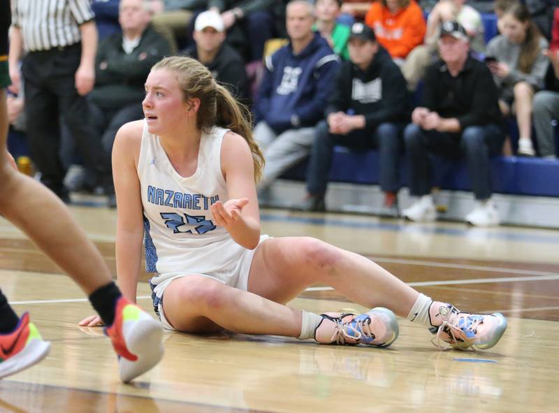 Nazareth's Amalia Dray (25) reacts to a no-call foul during the girls varsity basketball game between Fremd and Nazareth on Monday, Jan. 9, 2023 in La Grange Park, IL.