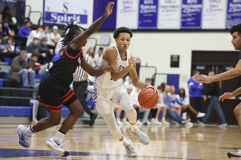 Lincoln-Way East’s Brent Taylor drives to the paint against Bolingbrook on Tuesday, Dec.12th, 2023 in Frankfort.