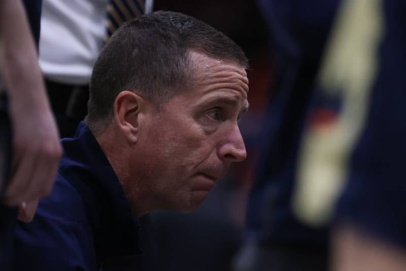 Lemont head coach Rick Runaas talks to his players during a timeout against Simeon in the Class 3A super-sectional at UIC. Monday, Mar. 7, 2022, in Chicago.