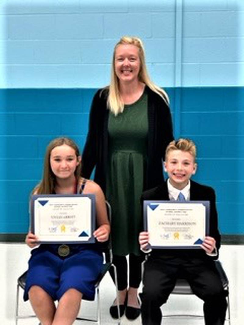 Troy Community School District 30-C has announced that five of its students were chosen by the Joliet Region Chamber of Commerce and Industry to receive Hawk Scholarships. Pictured: Vivian Abbott and Zachary Harrison with W.B.O. Principal Kelly Landers