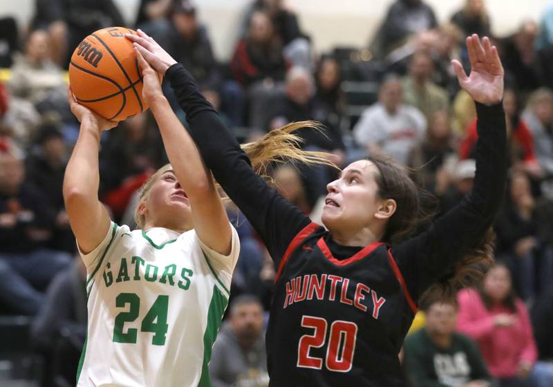 Crystal Lake South's Gracey LePage has her shot blocked by Huntley's Alyssa Borzych during a Fox Valley Conference girls basketball game on Friday, Jan. 30, 2026, at Crystal Lake South High School.