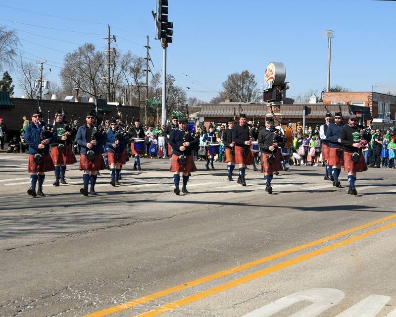 The City of Chicago Pipe band performs throughout the Countryside St. Patrick’s Day parade route on Saturday March 2, 2024.