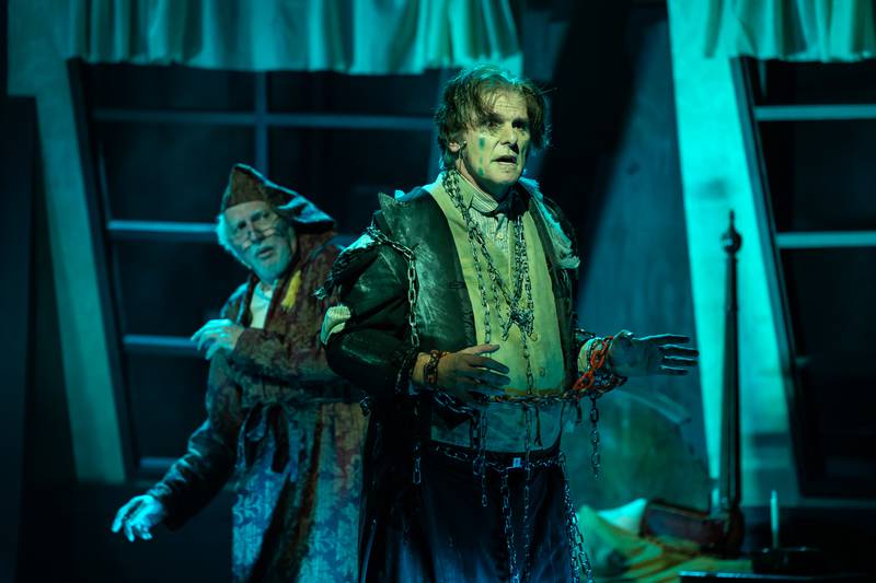 Scrooge (Stephen Connell of Crystal Lake encounters the ghost of Marley (Kent Joseph) in "A Christmas Carol" at the Metropolis Performing Arts Centre in Arlington Heights through Dec. 23, 2024.