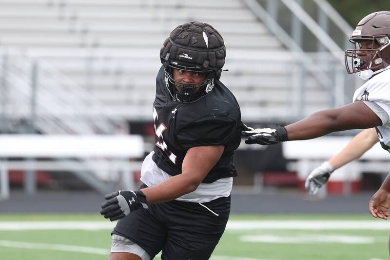 Plainfield North’s Andre Deal rolls around a blocker during a scrimmage against Joliet Catholic on Thursday, July 13th, 2023 at Plainfield North