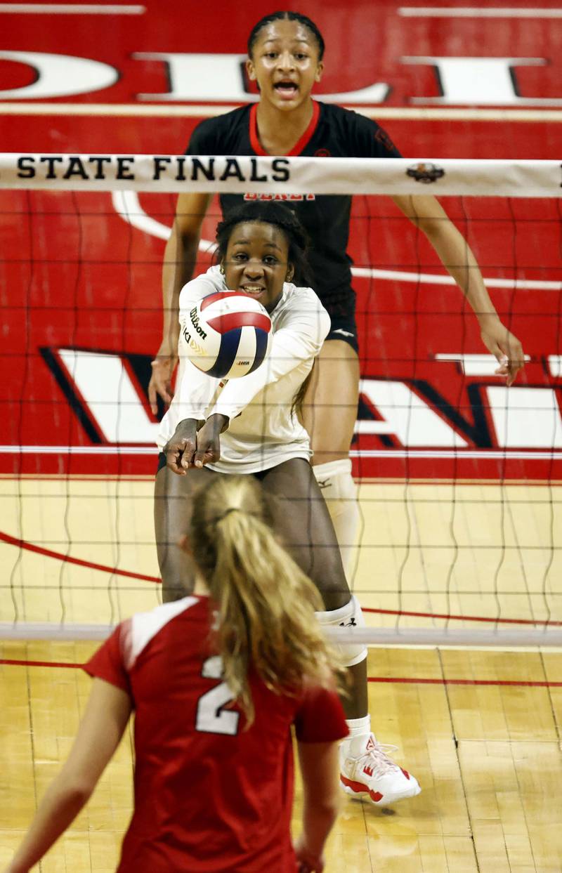 Benet Academy's Aniya Warren (8) passes to a teammate during the IHSA Class 4A girls volleyball championship match Saturday, Nov. 16, 2024 at CEFCU Arena in Normal.