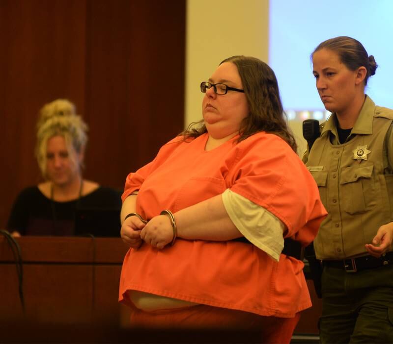 Sarah Safranek is escorted into an Ogle County court room on Wednesday, Oct. 25, 2023.