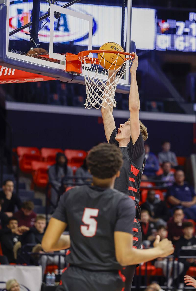 Benet’s Colin Stack (42) with a dunk against DePaul College Prep during the IHSA Class 4A boys basketball state semifinal Friday, March 13, 2026 at the State Farm Center in Champaign.