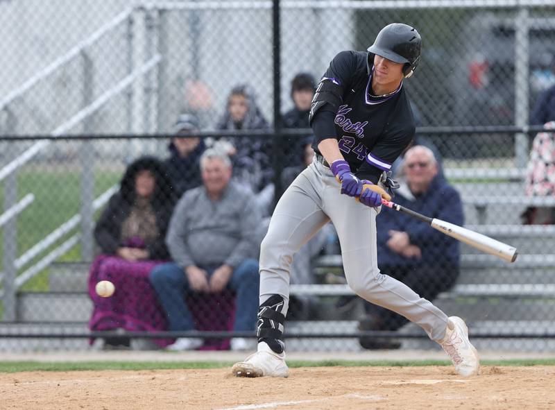 Downers Grove North's George Wolkow (24) swings at a pitch during the varsity baseball game between Downers Grove South and Downers Grove North in Downers Grove on Saturday, April 29, 2023.