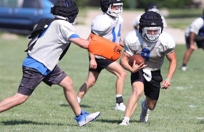 Genoa-Kingston's Nolan Perry carries the ball Wednesday, Aug.10, 2022, during practice at the school in Genoa.