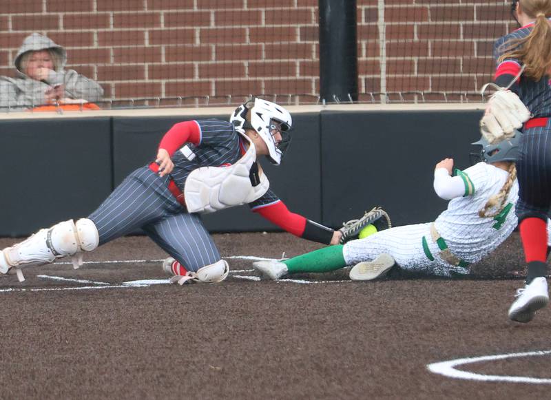 Ottawa catcher Bobbi Snook tags out Seneca's Greysen Provance while sliding into home plate on Friday, May 1, 2026 at Seneca High School.