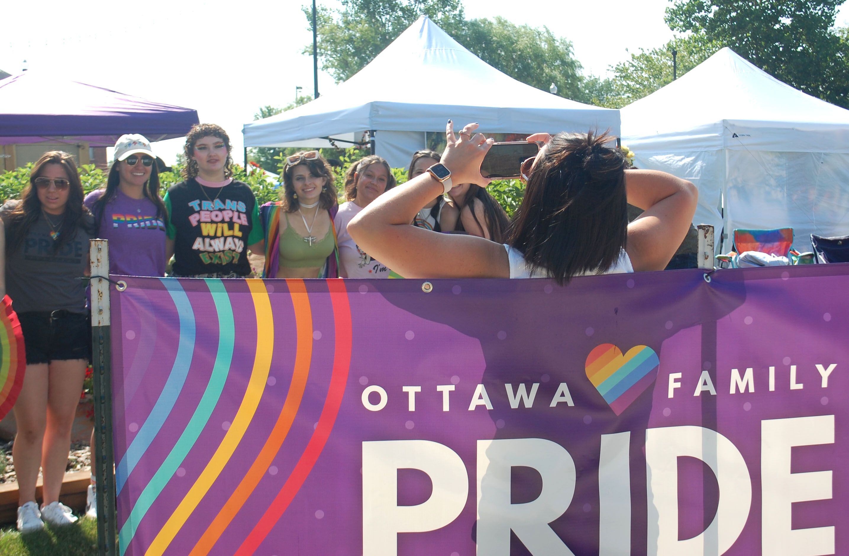 A group have their picture taken at the Jordan block in downtown Ottawa during the Ottawa Family Pride Festival on Saturday, June 10, 2023.
