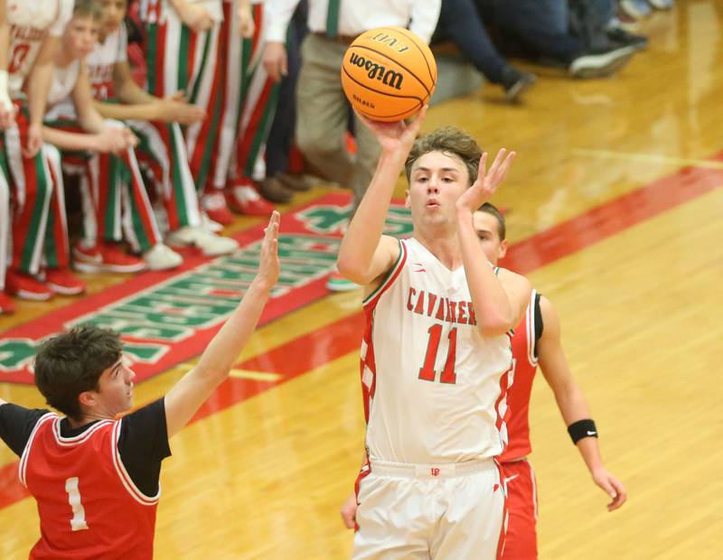 L-P's Jameson Hill lets go of a shot over Ottawa's Colt Bryson during the Class 3A Regional title game on Wednesday, Feb. 25, 2026 in Sellett Gymnasium at L-P High School.