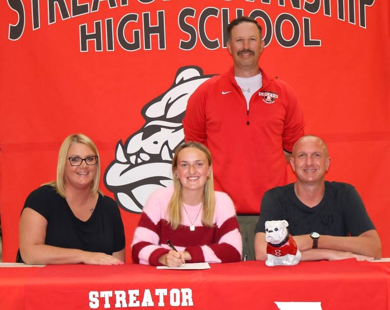Recent Streator graduate Josie Goerne has signed to continue her education at Illinois Valley Community College in Oglesby and her soccer career at the NJCAA level with the Eagles. Goerne, a sweeper for the Bulldogs and the 2024 Times Girls Soccer Player of the Year, is pictured (front, center) at her signing ceremony seated alongside her parents, with Streator soccer coach J.T. Huey standing behind.