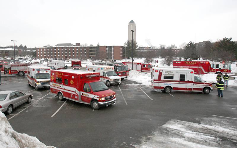 Shaw Local 2008 file photo – A parking lot near Cole Hall on the DeKalb campus of Northern Illinois University Feb. 14, 2008 became a staging area for emergency personnel who responded to a shooting in