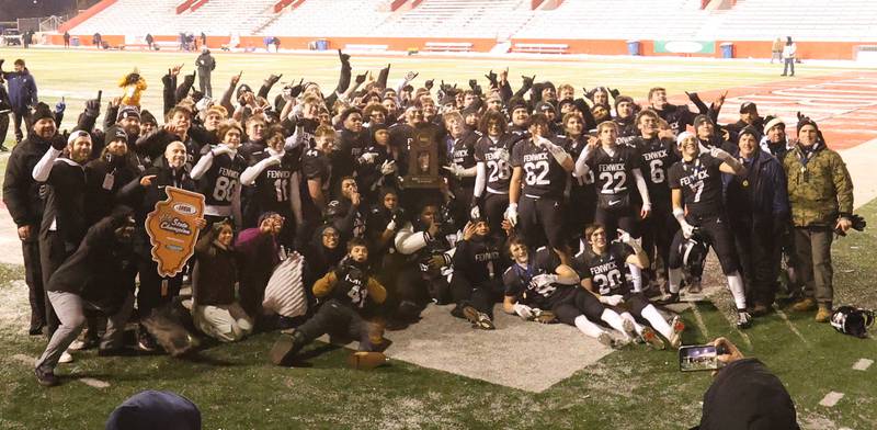 Members of the Fenwick football team pose with the  Class 6A State championship trophy on Tuesday, Dec. 2, 2025 in Hancock Stadium at Illinois State University in Normal.