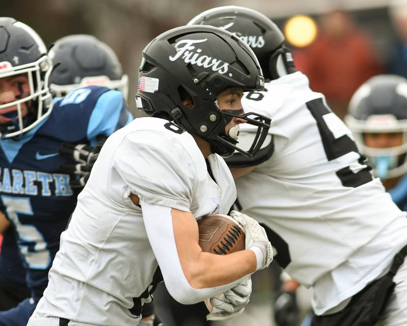 Fenwick's Jake Thies (8) runs the ball while taking on Nazareth Academy during the 6A semifinals game on Saturday Nov. 22, 2025, held at Nazareth Academy High School in La Grange Park.