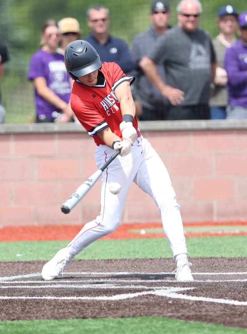 Hinsdale Central's Max Merlo (11) makes contact with the ball during the IHSA Class 4A baseball regional final between Downers Grove North and Hinsdale Central at Bolingbrook High School on Saturday, May 27, 2023.