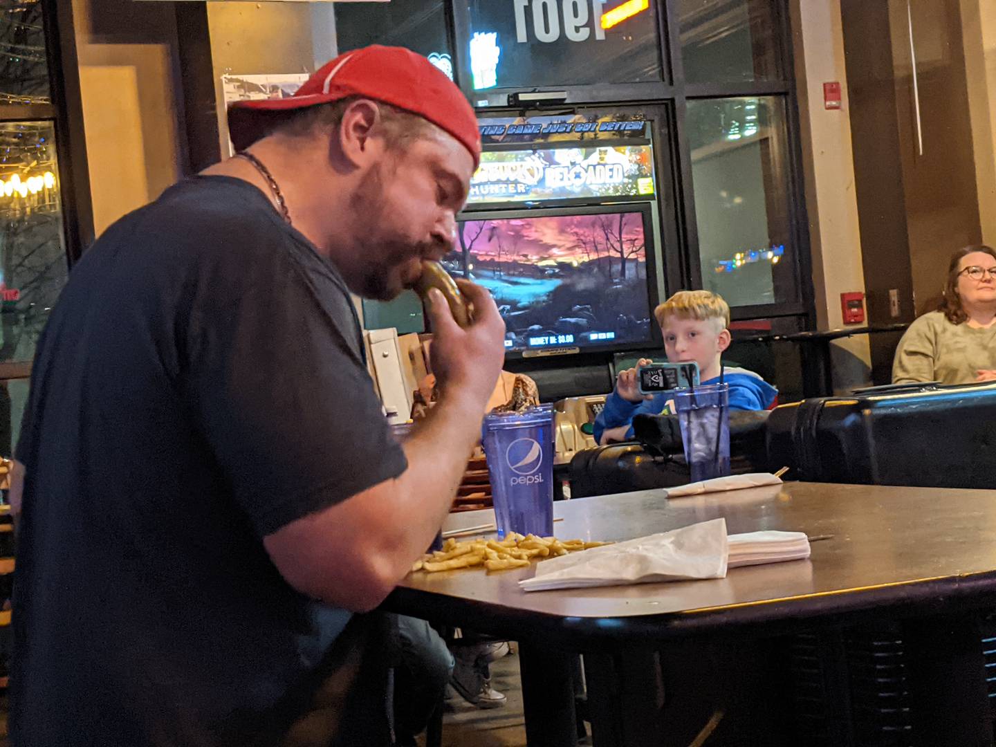 Those at Roadhouse 47 in Yorkville Jan. 26 cheered on professional eater and YouTube star Randy Santel as he dug into the four servings of fries that accompanied the Big Hoss burger.