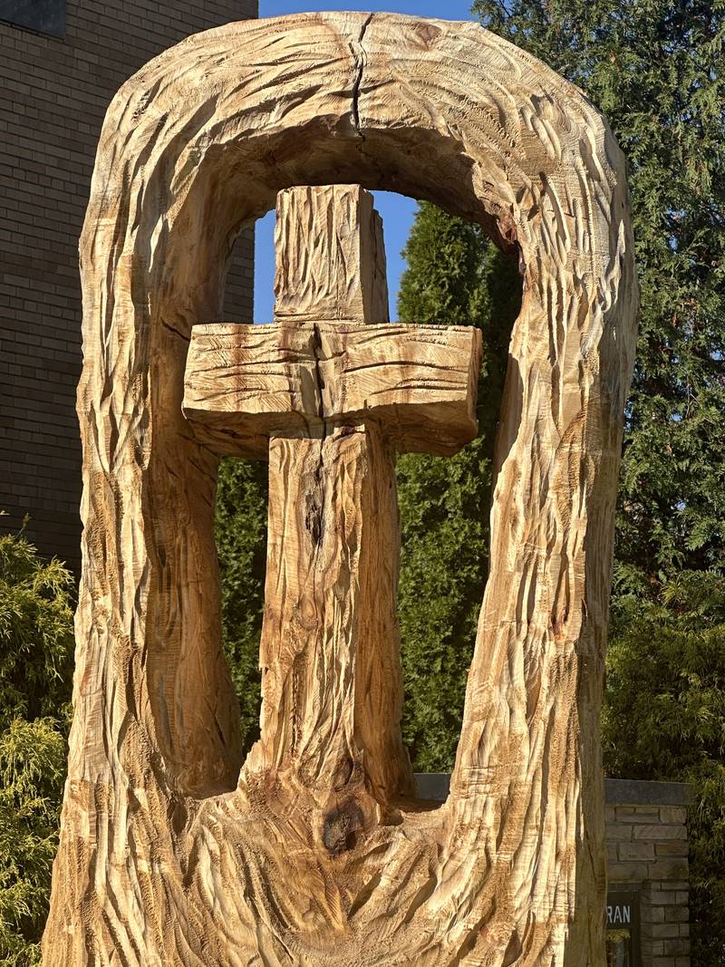 A view of the finished cross that Bud Hainzinger of Morris carved n a tree stump at St. Johns Lutheran Church on Thursday, Nov. 9, 2023 in Peru. The family of Don and Ruth Johnson members of our church family who passed away donated the cost of getting this done in memory and honor of their parents.