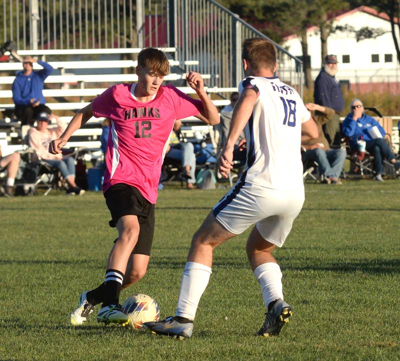 Oregon's Owen Wynn (12) moves with the ball as Faith Christian's Vander Bodzioch (18) defends on Thursday, Oct. 9, 2025 at Oregon Park West.