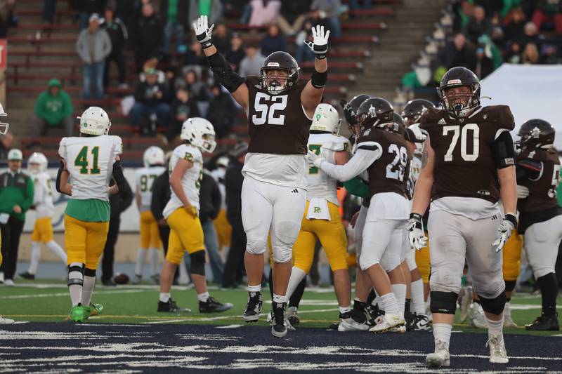 Joliet Catholic’s Brady McKeaon, 52, celebrates as the clock expires in the win against Providence in the Class 5A semifinal on Saturday, Nov. 18, 2023, in Joliet.