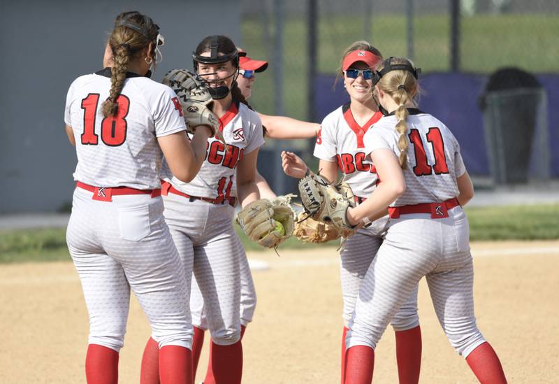 The Bradley-Bourbonnais infield exchange high-fives after getting an out in the fourth inning of a game against Manteno on Thursday, May 15, 2025.