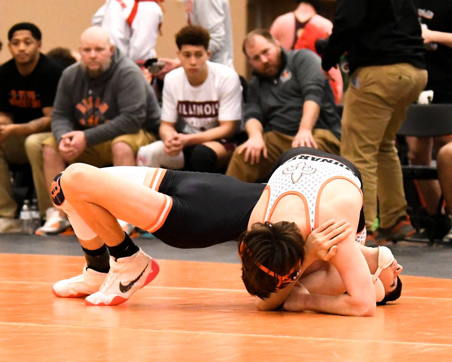 St. Charles East Dom Munaretto pins DeKalb’s wrestler Eduardo Castro in the 106 weight class during the first round on Friday Dec. 30th in The Don Flavin wrestling Invite held at DeKalb High School.