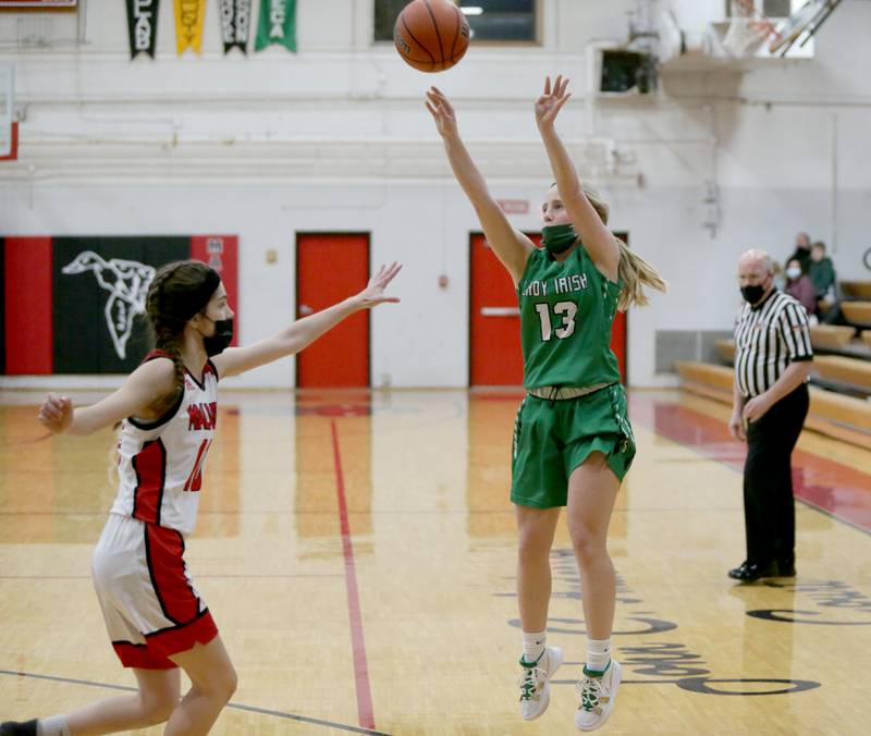 Seneca's Kennedy Hartwig, (13) shoots a 3-pointer over Henry-Senachwine's Hope Self (10) last January.