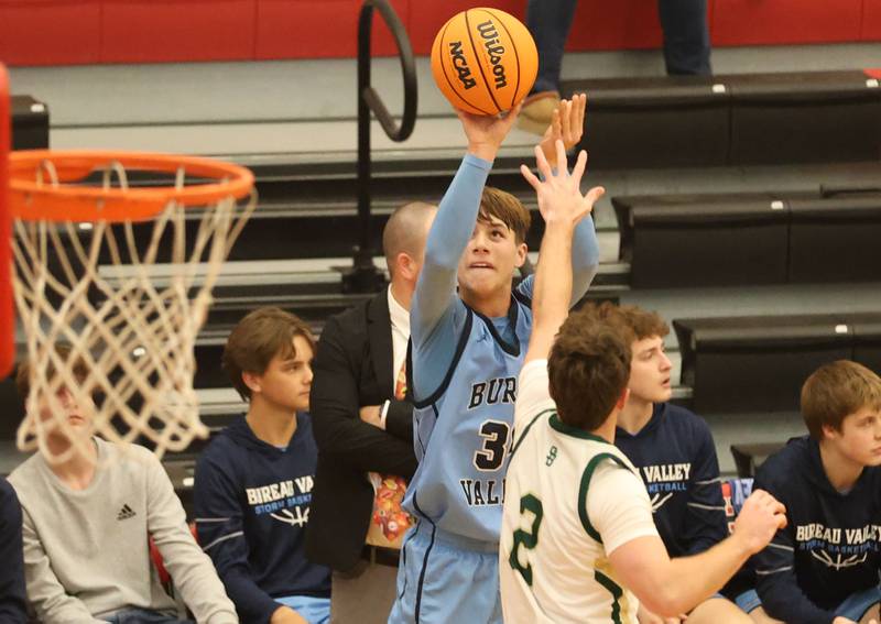 Bureau Valley's Carson Gruber shoots a jump shot over St. Bede's Gus Burr during the Colmone Classic on Thursday, Dec. 11, 2025 at Hall High School.
