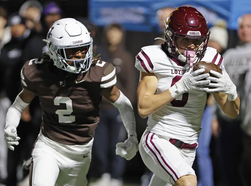 Loyola's Will Carlson (0) runs after making a catch during the varsity football game between Loyola Academy and Mt. Carmel high school on Friday, Oct. 25, 2024 in Chicago.