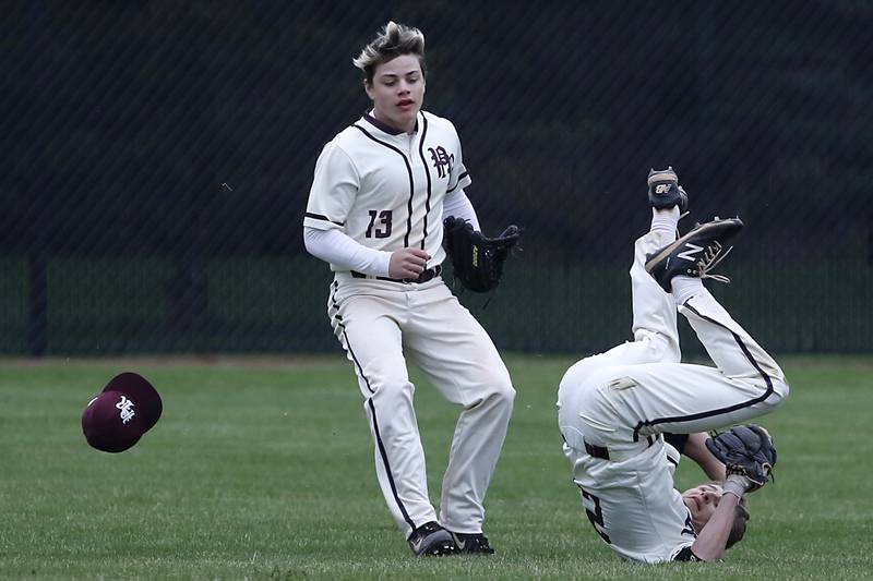 Prairie Ridge's Tyler Vasey flips over in front of his teammate after making a catch during a Fox Valley Conference baseball game Friday, April 29, 2022, between Prairie Ridge and Jacobs at Prairie Ridge High School.