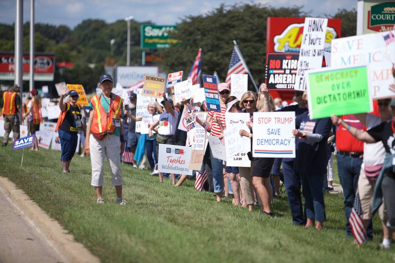 People rally on Labor Day, Sept. 1, 2025, for "Workers over Billionaires" along Route 64 in St. Charles.