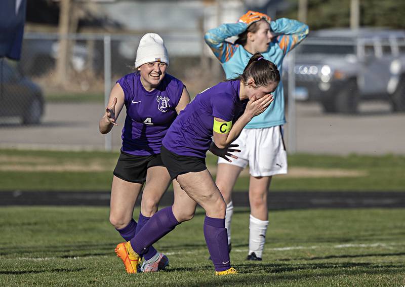 Dixon’s Avery Burmeister (right) and teammate Carlie Cook react to Burmeister missing an open goal Monday, April 10, 2023 against Harlem.