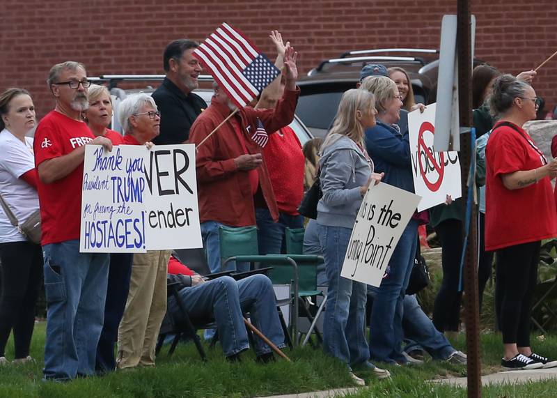Supporters stand holding signs during A Night of Hope and Unity in honor of Charlie Kirk's birthday on Tuesday, Oct. 14, 2025 at City Hall Park in Princeton. The hour-long gathering paid tribute to Charlie along with standing up for peace, school shootings, violence and division.