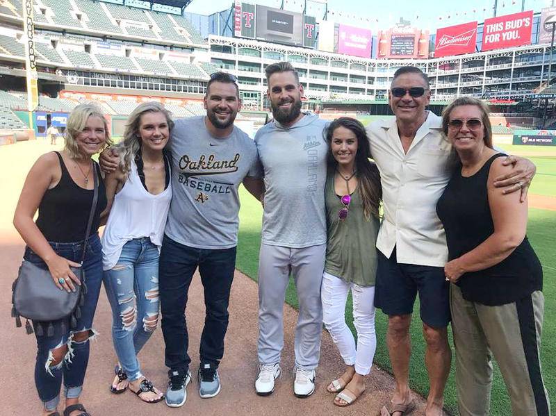 The Martini family joined Nick Martini, a 2008 Prairie Ridge graduate, for his first major league game Wednesday night when he played for the Oakland A's in Texas. Joining Nick (center) are (from left) his sisters, Hannah and Maddy, his brother, Alex, his girlfriend, Kaylin Dietrich, and his parents, Scott and Kris.