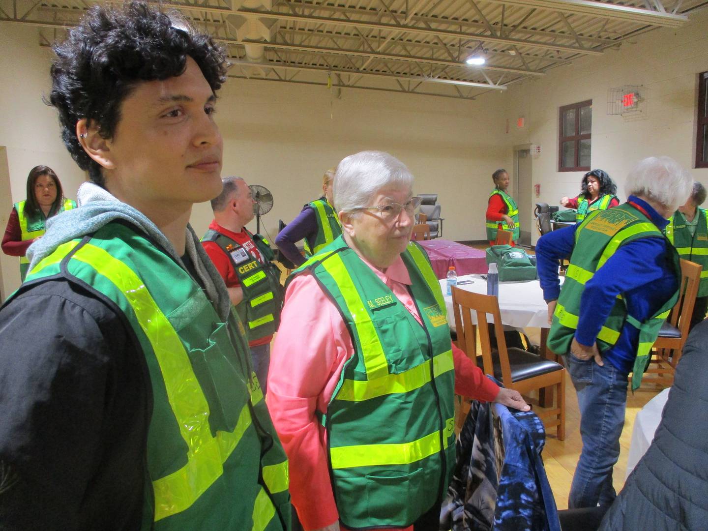 Jesus Najera (left) and Sister Mary Frances Seeley listen to instructions at a meeting of the Joliet Certified Emergency Response Team on Thursday. May 22, 2025