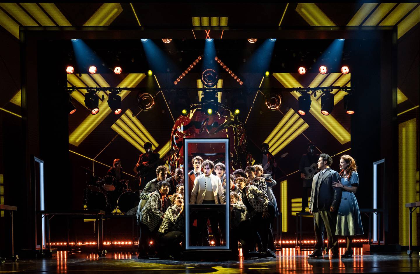 Ali Louis Bourzgui as Tommy Walker (center) joined by the company of
The Who’s Tommy,
with (far right) Tommy’s parents, Captain Walker (Adam Jacobs) and Mrs. Walker (Alison Luff