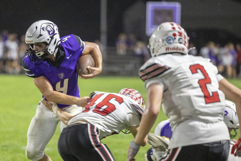 Dixon’s Landon Knigge avoids a tackle against Stillman Valley’s Ethan Waugh Friday, Oct. 3, 2025.