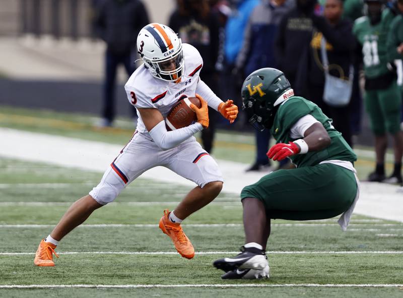 Oswego's Devin Mata (3) runs the ball during the varsity football second-round 8A playoff game between Oswego and Lane Tech on Saturday, Nov. 8, 2025 in Chicago.