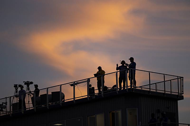 The early evening sky silhouettes workers Friday, Sept. 1, 2023 at the Sterling vs St Francis football game in Sterling.