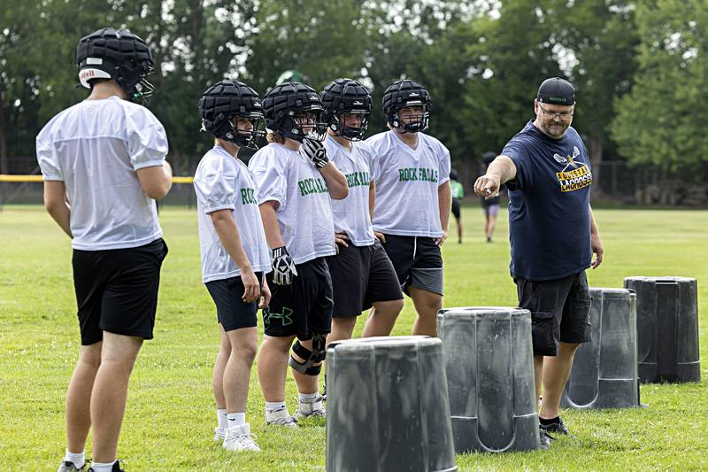 Rock Falls head coach Kevin Parker runs his team through drills Tuesday, August 8, 2023 during the first week of football practice.