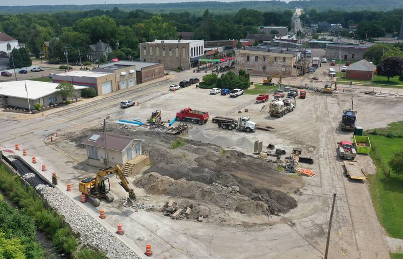Crews continue to work on the site of the Utica retail plaza near the intersection of Mill and Grove streets on Wednesday, July 24, 2024 in Utica. Workers have begin replacing water lines, adding rock and preparing to redo the the Market on Mill area. The project is scheduled to be completed just before Burgoo.