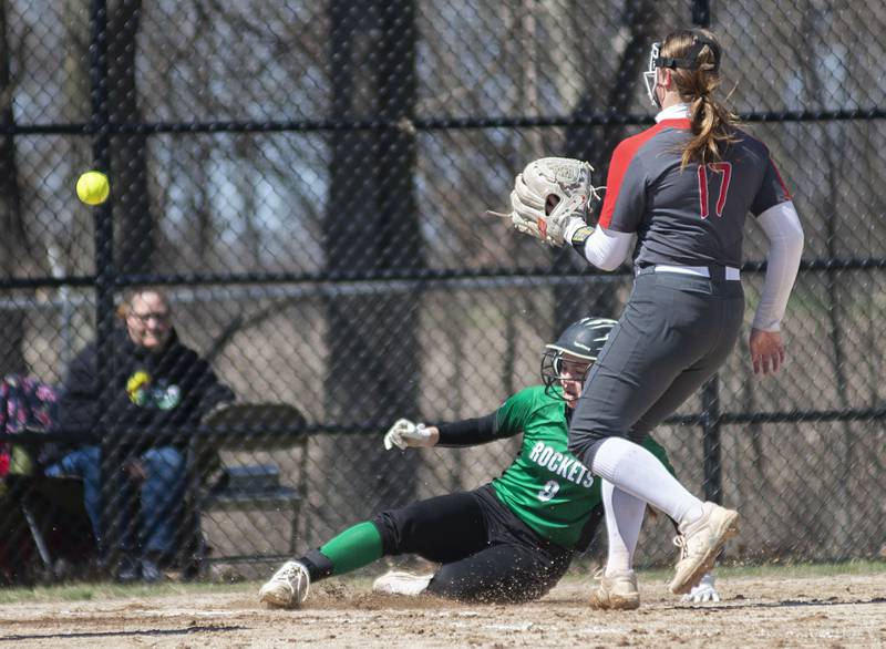 Rock Falls' Rylee Johnson slides in safely at home to score against Ottawa Saturday, April 9, 2022.