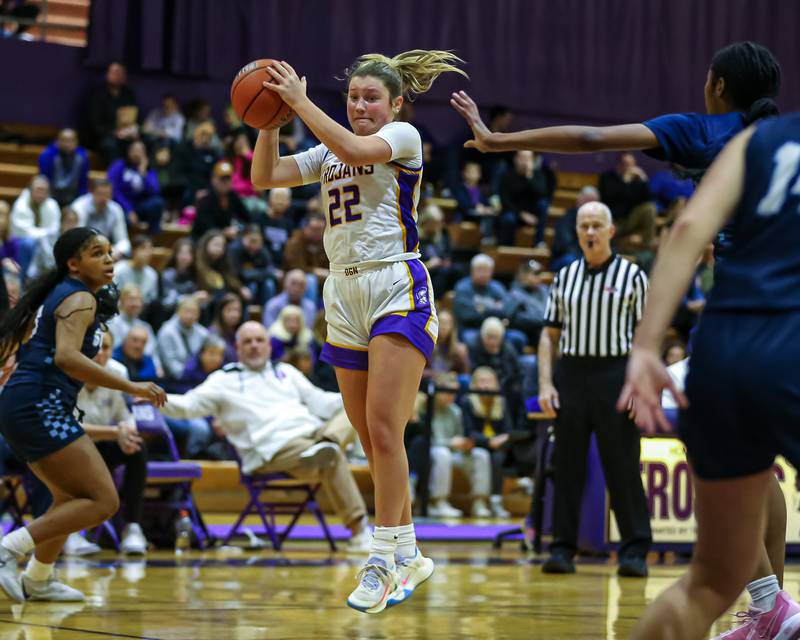 Downers Grove North's Lilly Boor (22) grabs a rebound during girls basketball game between Downers Grove South at Downers Grove North. Dec 16, 2023.